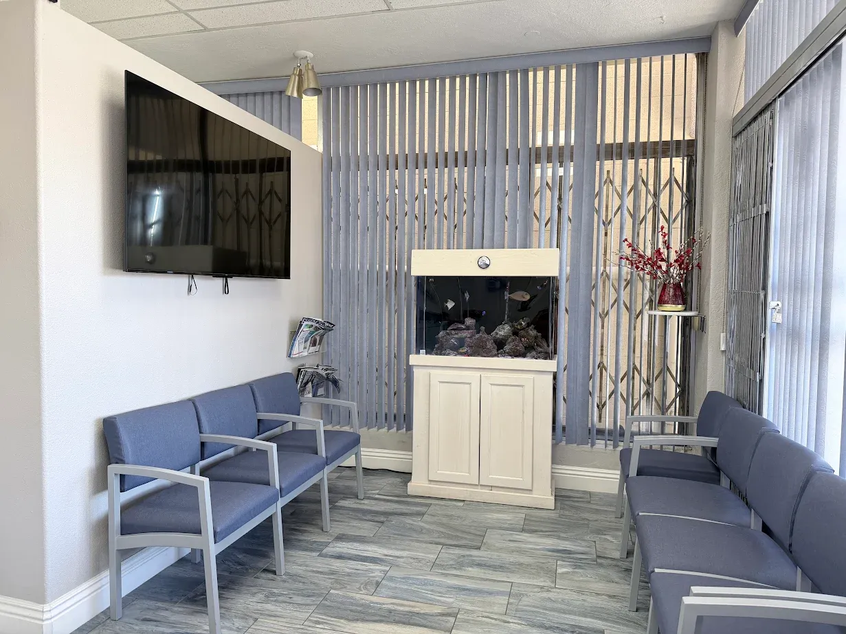 Anaheim Implants & Dental Group waiting area with seating and aquarium.